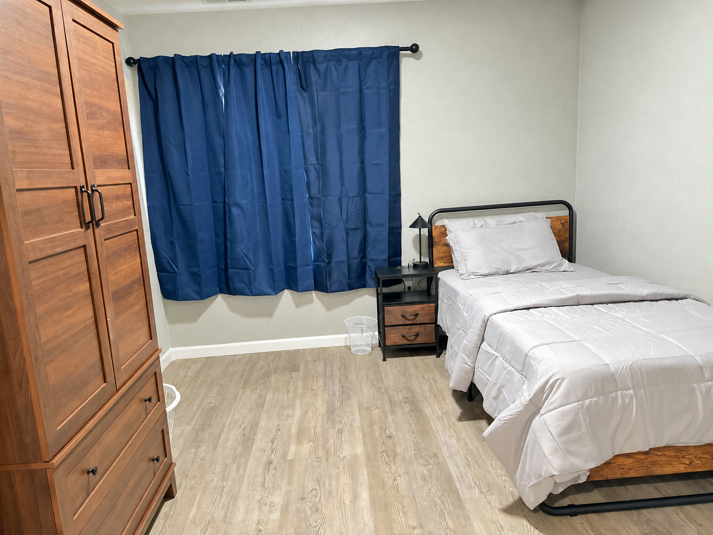 Bedroom detail with nightstand and lamp