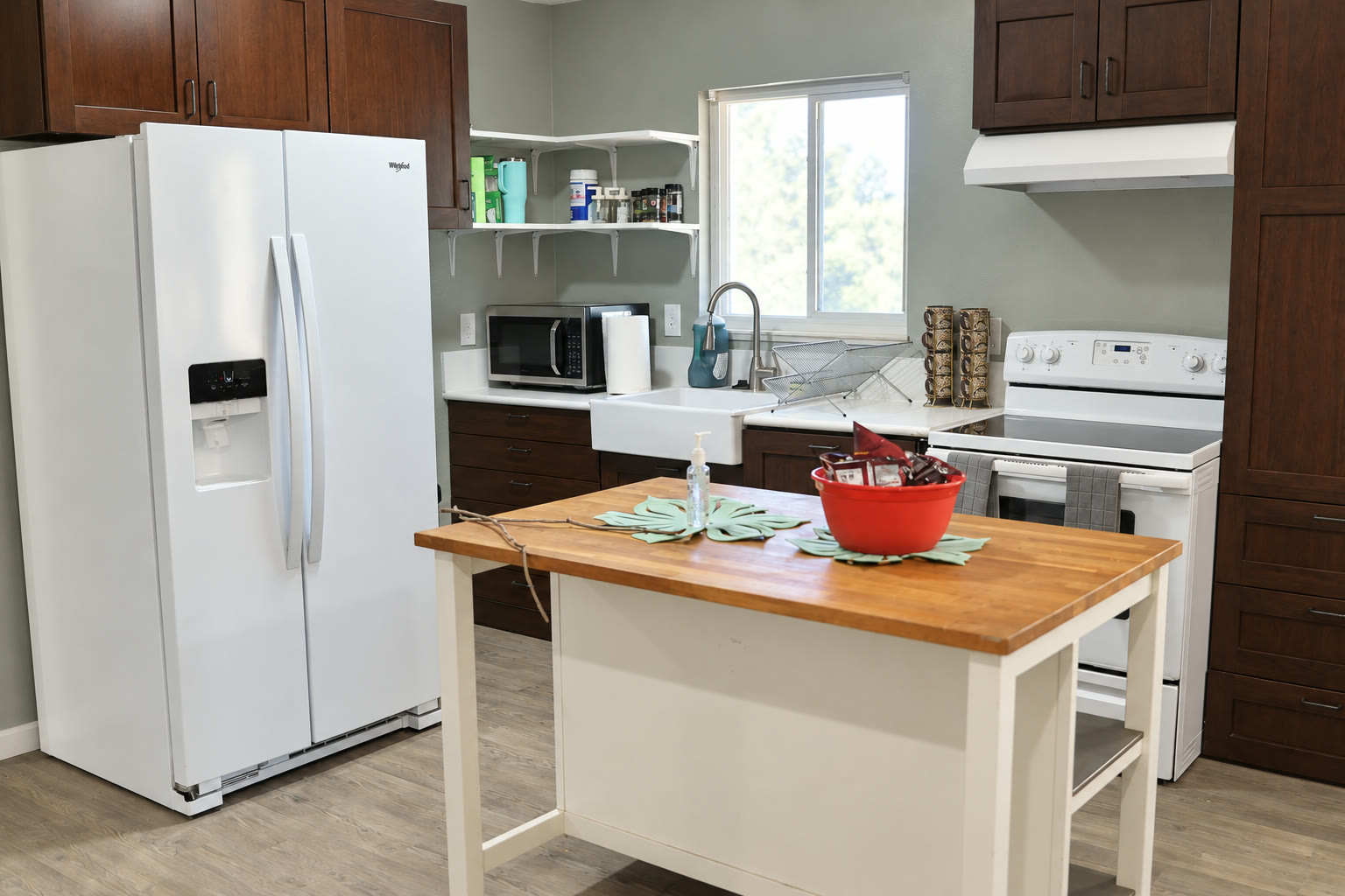 Bright kitchen with center preparation island and modern appliances
